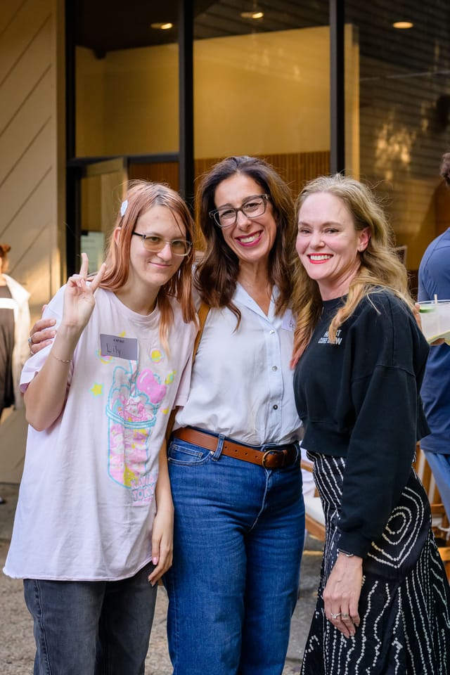 Sarah with two guests outside the studio