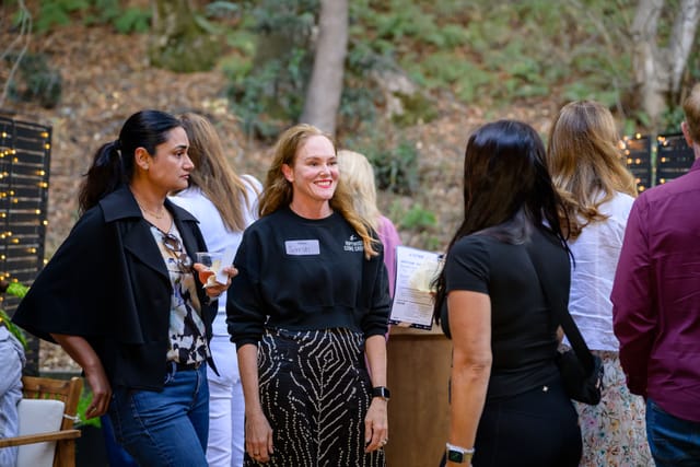 Sarah mingling with guests in the courtyard