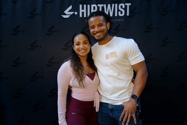 A couple smiling at the photo booth