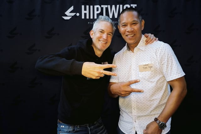 Two guests throwing peace signs