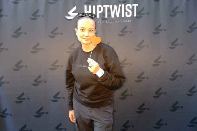 A guest holding a heart prop