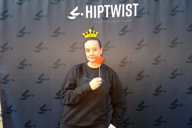 A guest with a crown and a heart prop