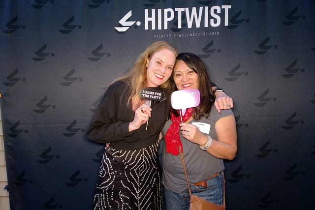 Sarah hugging a guest at the photo booth