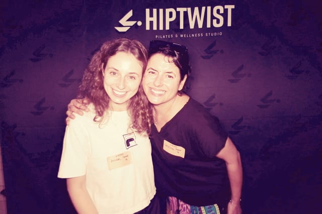Two guests hugging at the photo booth