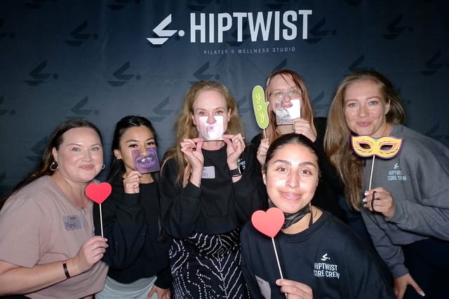 Sarah and the team clowning with mouth props