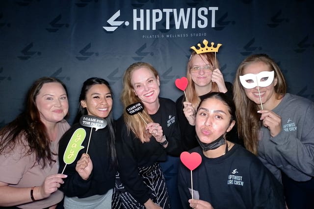 Sarah and the team with crowns, hearts and masks