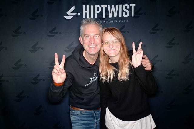 Two guests throwing peace signs