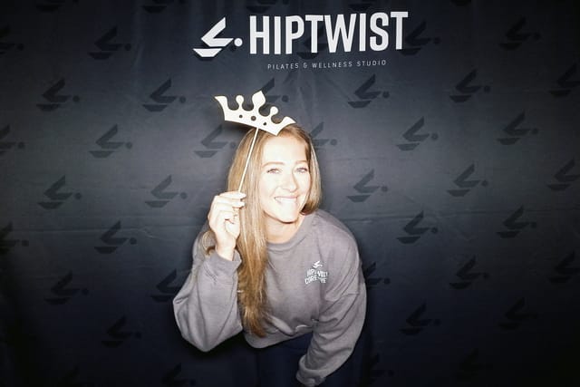 A guest with a crown prop