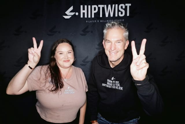 Two guests throwing peace signs