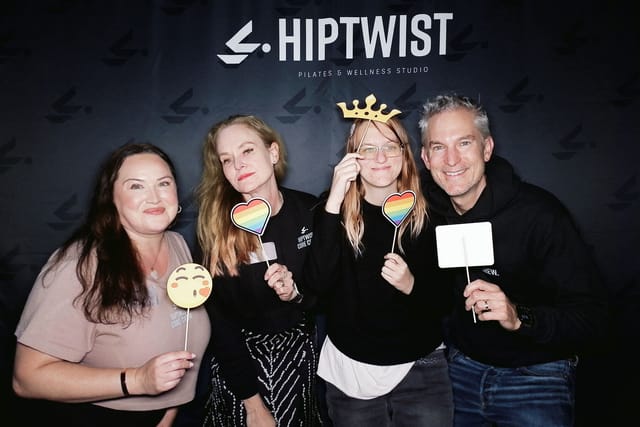Sarah and the team with rainbow hearts and a crown