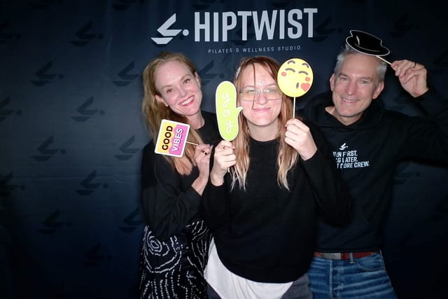 Sarah and two others with &ldquo;yay&rdquo; and emoji props