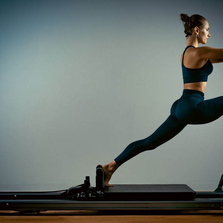 Pilates practitioner on a reformer